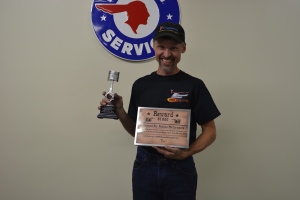 Jeff Kauffman with his fPe tropyh and award